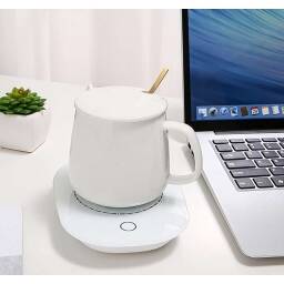 Taza de cermica blanca con base calentadora